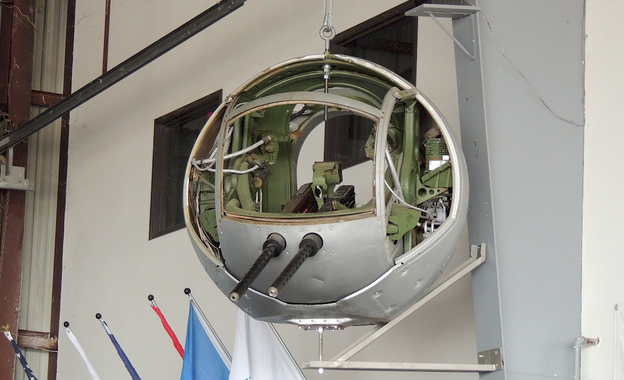 Aircraft Ball Turret on the Wall of a Hangar
